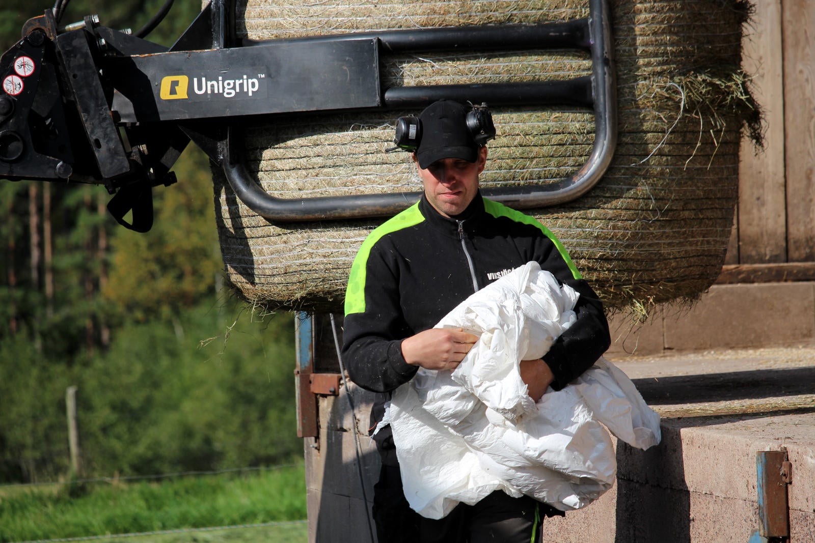 Farmer Recycling Silage Wrap